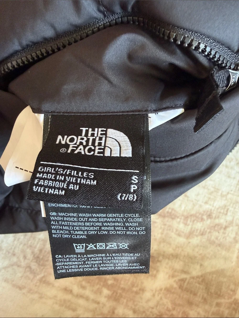 The North Face Children’s Hooded Faux-Fur Reversible Puffer Jacket in Black